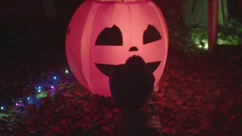 4K wacky inflatable ghost kid pumpkin halloween trick r treat Stock Footage 149721132