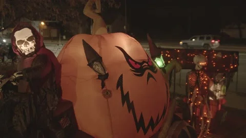 4K wacky inflatable ghost skeleton reaper pumpkin halloween trick or treat Stock Footage 149717744