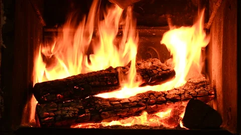 4K Warm cozy burning fire in a brick fireplace, close-up shot Stock Footage 146010619