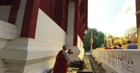 4k - Wat Pra Singh temple - monks taking video Stock Footage 68787476