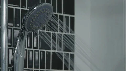 4k of Water drops in the shower head Stock Footage 76904955