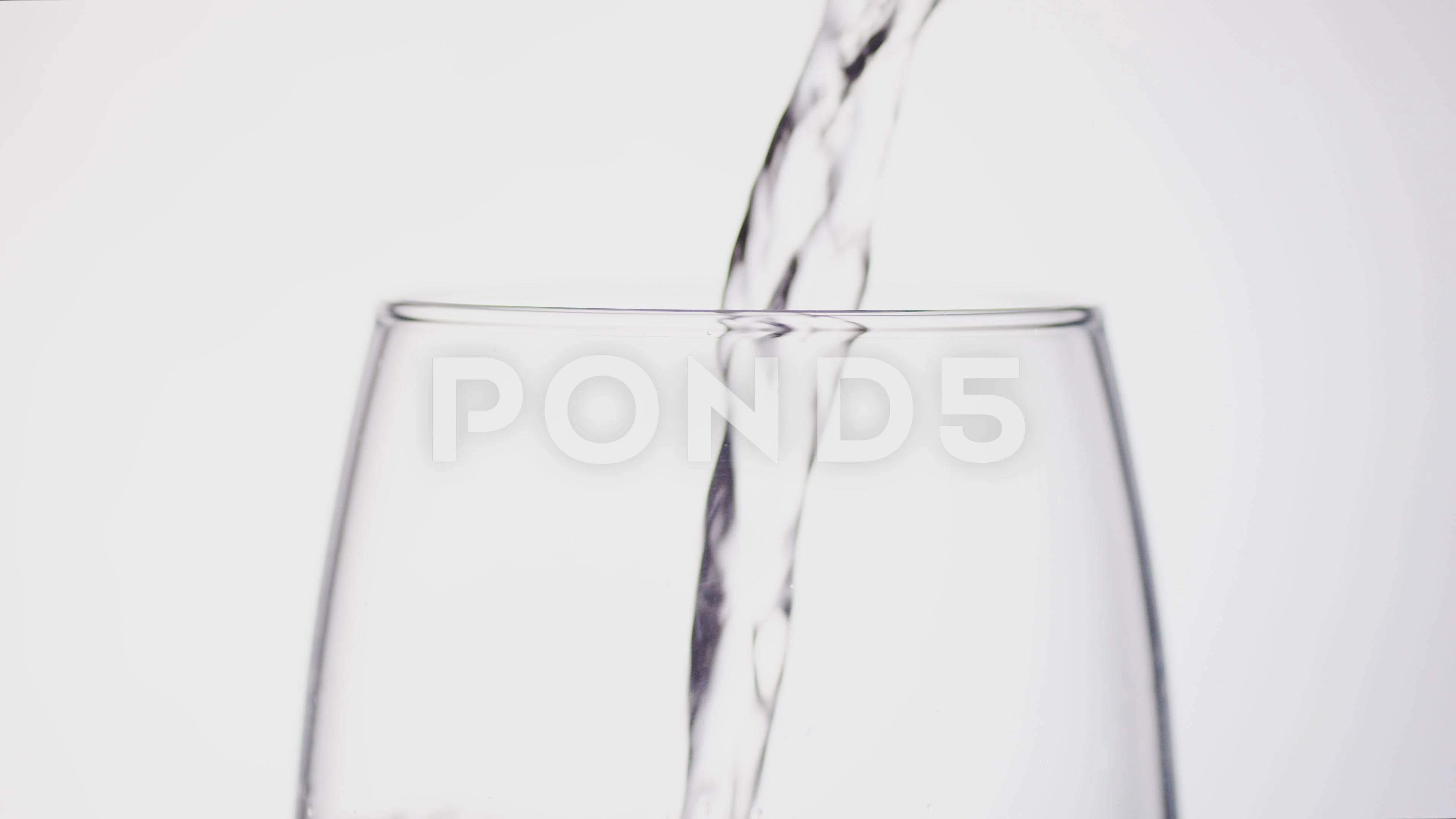4K Water filling up the top of a glass, ... | Stock Video | Pond5