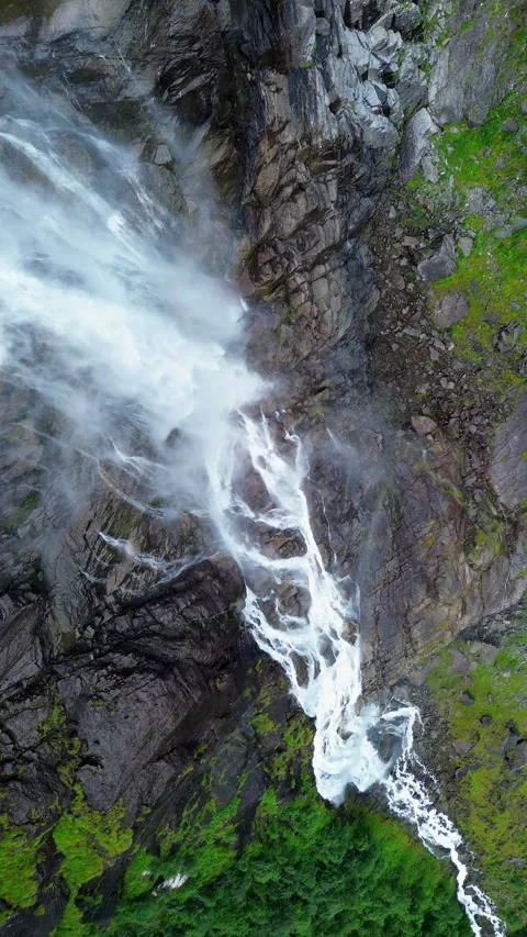 4K Waterfall Cascading Down Rocky Terrain in Norway's Natural Beauty Stock Footage 296023782