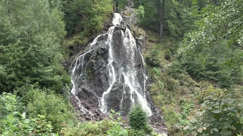 4k Waterfall in low mountain range Harz with tourists Stock Footage 41866066