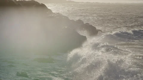 4K: Wave with Spray Crashing into Cliffside Rock in Late Epic Light Stock Footage 66005867