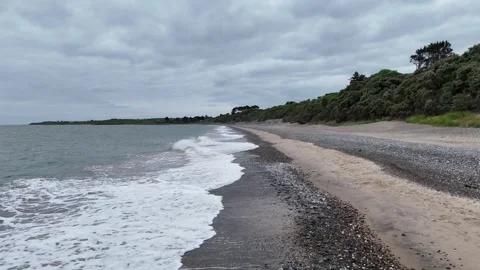 4K Waves Along Kortaun Beach, Ireland Under Cloudy Sky 스톡 동영상 332876484