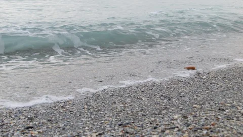 4K Waves breaking along the pebble beach. Waves is coming after wave Stock-Footage 100124734