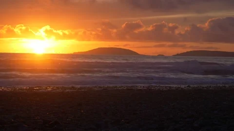 4K waves breaking along the Welsh shoreline during sunset,  Llŷn Peninsula 動画素材 196748623