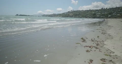 4K - Waves lap at white Sandy Beach. Stock Footage 225605524
