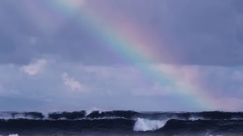 4K: Waves on Lower 3rd of Screen with Rainbow Across Stock Footage 72691041