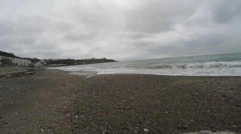 4K waves rolling in on pebble beach in douglas isle of man Stock Footage 45701890