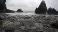 4k waves rolling in on rough beach, giant boulders in the water 4k or 4k+ Resolution