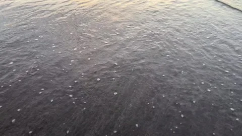 4K Waves Washing Over Black Sand Beach in Tamsui Taiwan Stock Footage 334772513