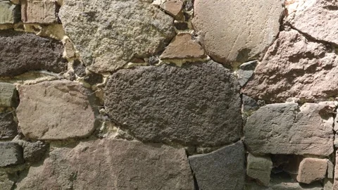 4K Weathered Stone Wall Texture Close Up Outdoor Rustic Masonry Backdrop Ro.. Stock Footage 346621187
