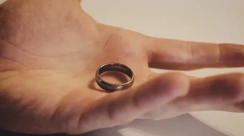4k - Wedding ring in hand, holding it Stock Footage 61250495