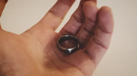 4k - Wedding ring in hand, holding it Stock Footage 61250498