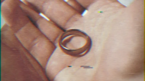4k -  wedding ring in hand VHS effect with distortion Stock Footage 63209223