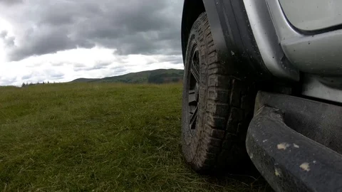 4K wheel driving through muddy water Stock Footage