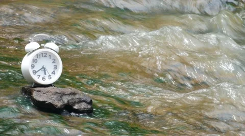 4K : White alarm clock on waterfall background soft focus, 스톡 동영상 66922744