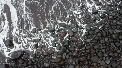 4K White foamy waves rolling onto black beach pebbles in Madeira,Seixal,Portugal Stock-Footage 223719030