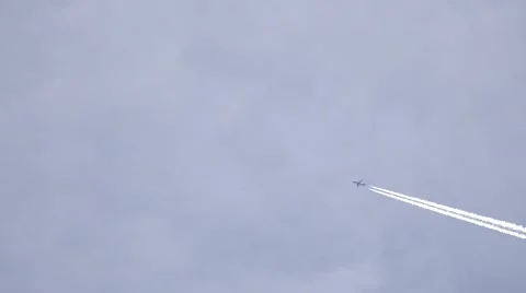 4K White trail plane blue sky commercial jet airplane atmosphere pollution day   Video stock 61342681