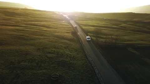 4k White van aerial tracking shot at sunset through beautiful countryside Stock Footage 105864485