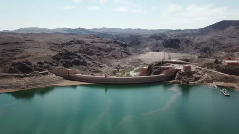 4K Wide Aerial View of a Large Dam Complex and Technical Buildings Stock Footage 331357428
