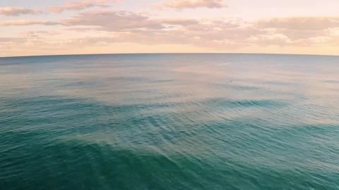 4K Wide Angle View Calm Ocean Horizon Sunset Pink and Orange Sky Video stock 334444514