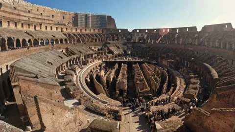 4k wide angle view inside the colosseum with tourists down the exploring the Stock Footage 235624113