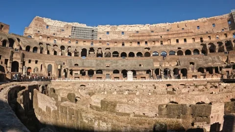 4k wide angle view inside the colosseum with tourists down the exploring the Stock Footage 235624366