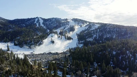 4K wide drone view of snowy Bear Mountain Ski Resort in Big Bear, California Stock Footage 121702355