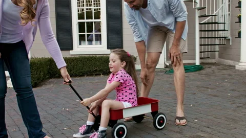 4k wide shot of father explaining to daughter how to ride for the first time on Stock Footage 201094895