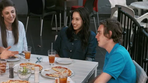 4k wide video of young multicultural group of young friends enjoying a meal, foo Stock Footage 201094621