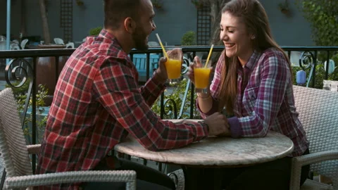4k wide video of young multiracial happy and romantic couple chatting on date in Stock Footage 201097164