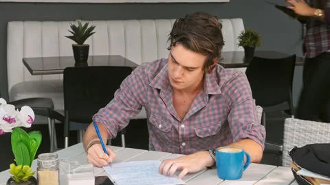 4k wide video of young student working writing notes and getting answers with br 動画素材 201095965