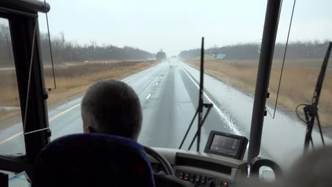 4K Wider Angle Shot Bus Driver Driving Down Highway On Rainy Day Stock Footage 89114820