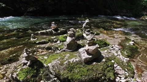 4K. Wild Radovna river flows in Vintgar Gorge and stone pyramids. Video stock 65407722