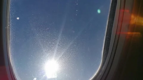 4k window view on the airplane, sun and clouds, aerial shot Stock Footage 295446660