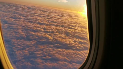 4k window view from the airplane, sunset, clouds, aerial shot Stock Footage 295161569