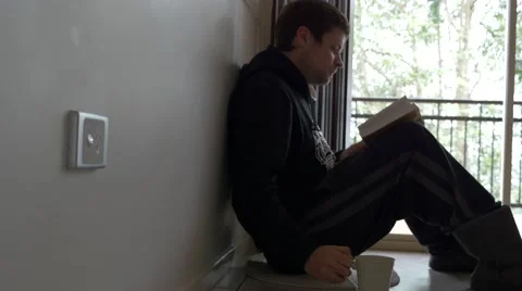 4k Winter Reading by Window 库存影片 40296662