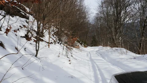 4K. Winter road between snow-capped mountains at high altitude Video stock 211708000