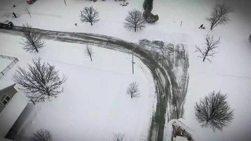 4k Winter storm snow removal from residential streets with snow plough Stock Footage 85676739
