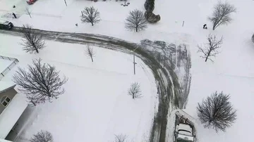 4k Winter storm snow removal from residential streets with snow plough Stock Footage 85676753