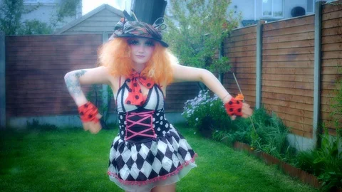 4k Woman Dressed up as Madhatter Posing and Dancing Stock Footage 129828853