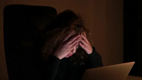 4K, A woman is overwhelmed while she works at night with her computer. Stock Footage 147848632