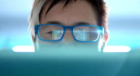 4K: A woman is using a tablet to play an online game Stock Footage 66041225
