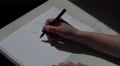 4K Woman writing I HATE YOU in black felt pen on white paper, adding fuck off 4k or 4k+ Resolution