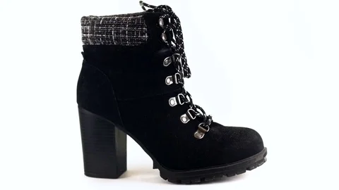 4k - Woman's boot rotating on white background Video stock 71901782