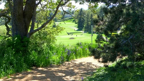 4K Wood Chip Trail with View Over Green Golf Course, Leisure Sport Beautiful Day Video stock 76922765