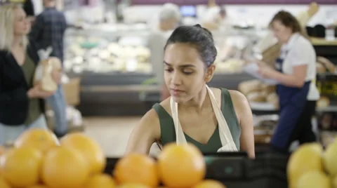 4K Worker in a supermarket looking at tablet computer &amp; checking stock Stock Footage 67958262